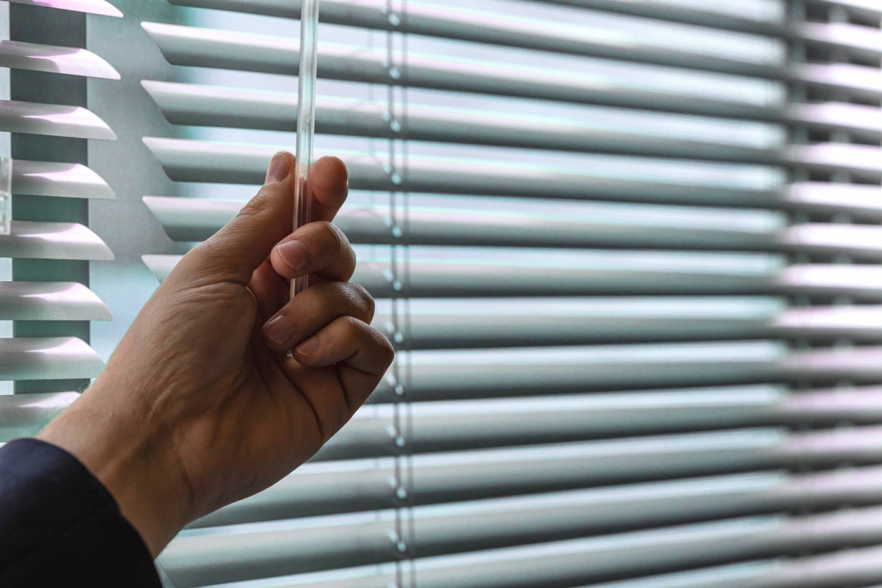 A hand operating window blinds at Kugler's Home Fashions near Silver Spring,(MD)